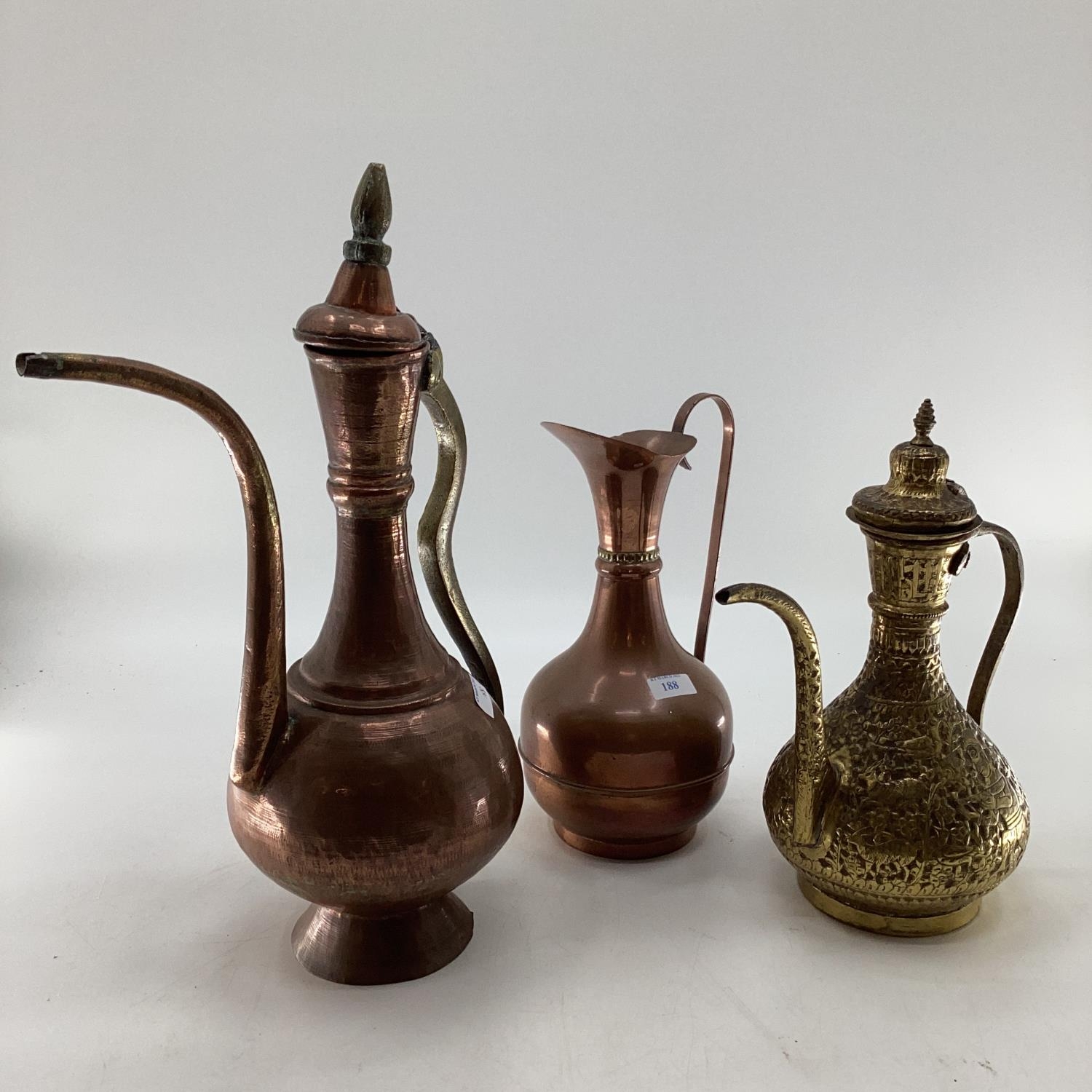 A collection of metalware to include Middle Eastern style ewers, trench art and other items - Image 11 of 15