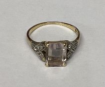 An 18ct gold, rose quartz set ring, with diamond set shoulders, size I