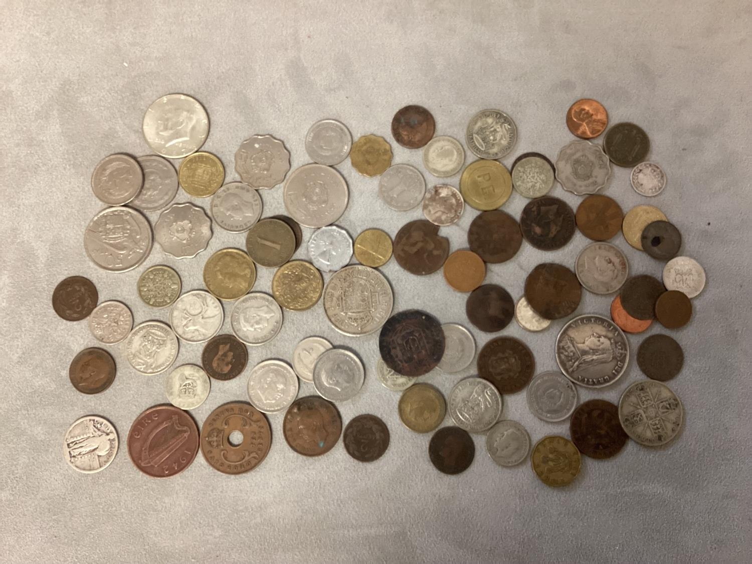 A collection of C20th and earlier coinage including silver coins and a rare trade token.