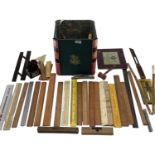 A collection of measuring instruments to include Set Square, rulers etc