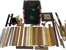 A collection of measuring instruments to include Set Square, rulers etc