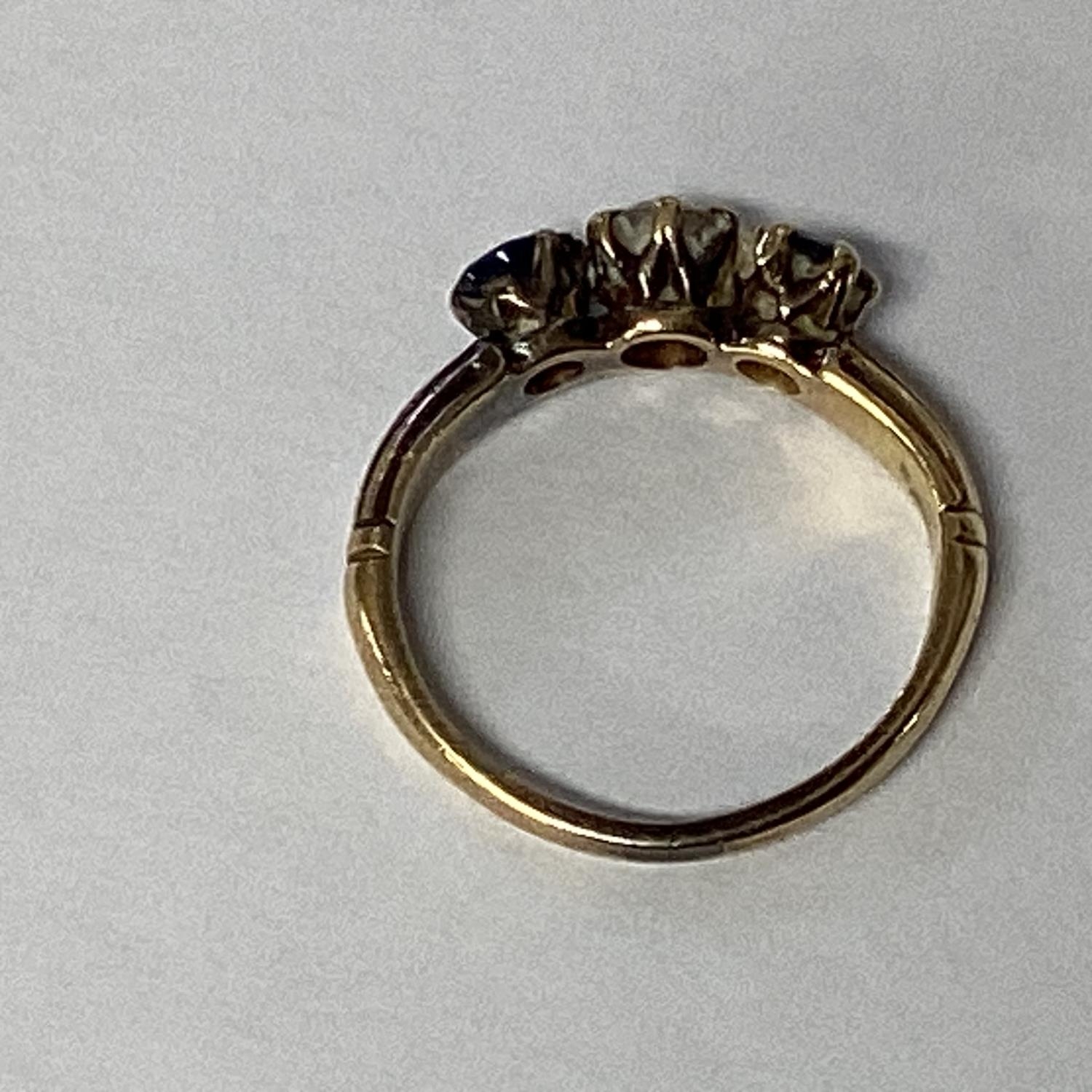 A sapphire and diamond ring in unmarked yellow metal central old diamond, with round cut sapphire - Image 5 of 5
