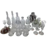 A collection of modern glassware to include Dartington decanters, embossed mugs, 6 champagne