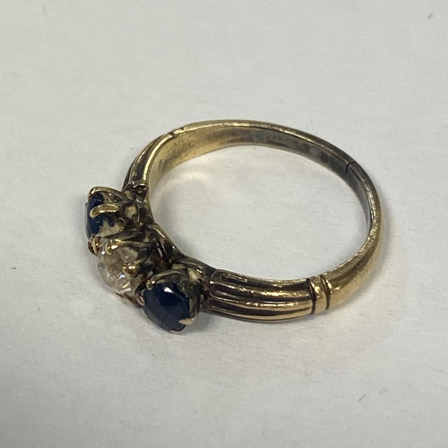 A sapphire and diamond ring in unmarked yellow metal central old diamond, with round cut sapphire - Image 3 of 5