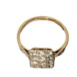 An 18ct gold and platinum diamond plaque ring, panel set with 12 single cut diamonds with diamond