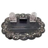 A Victorian black lacquer and inlaid mother of pearl desk tidy/standish, with original glass