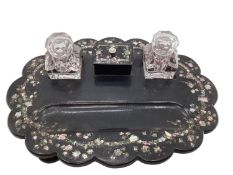 A Victorian black lacquer and inlaid mother of pearl desk tidy/standish, with original glass