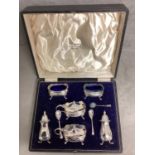 A boxed sterling silver condiment set by Walker and Hall, Chester, 1939 grams