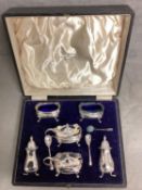 A boxed sterling silver condiment set by Walker and Hall, Chester, 1939 grams