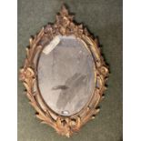 Oval gilt framed mirror, with swags and garlands to each side and finial, as found 75cm W x 108cm H