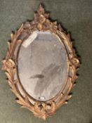 Oval gilt framed mirror, with swags and garlands to each side and finial, as found 75cm W x 108cm H