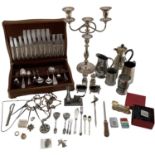 A collection of metalware to include an oak cased canteen of cutlery, candelabra, etc
