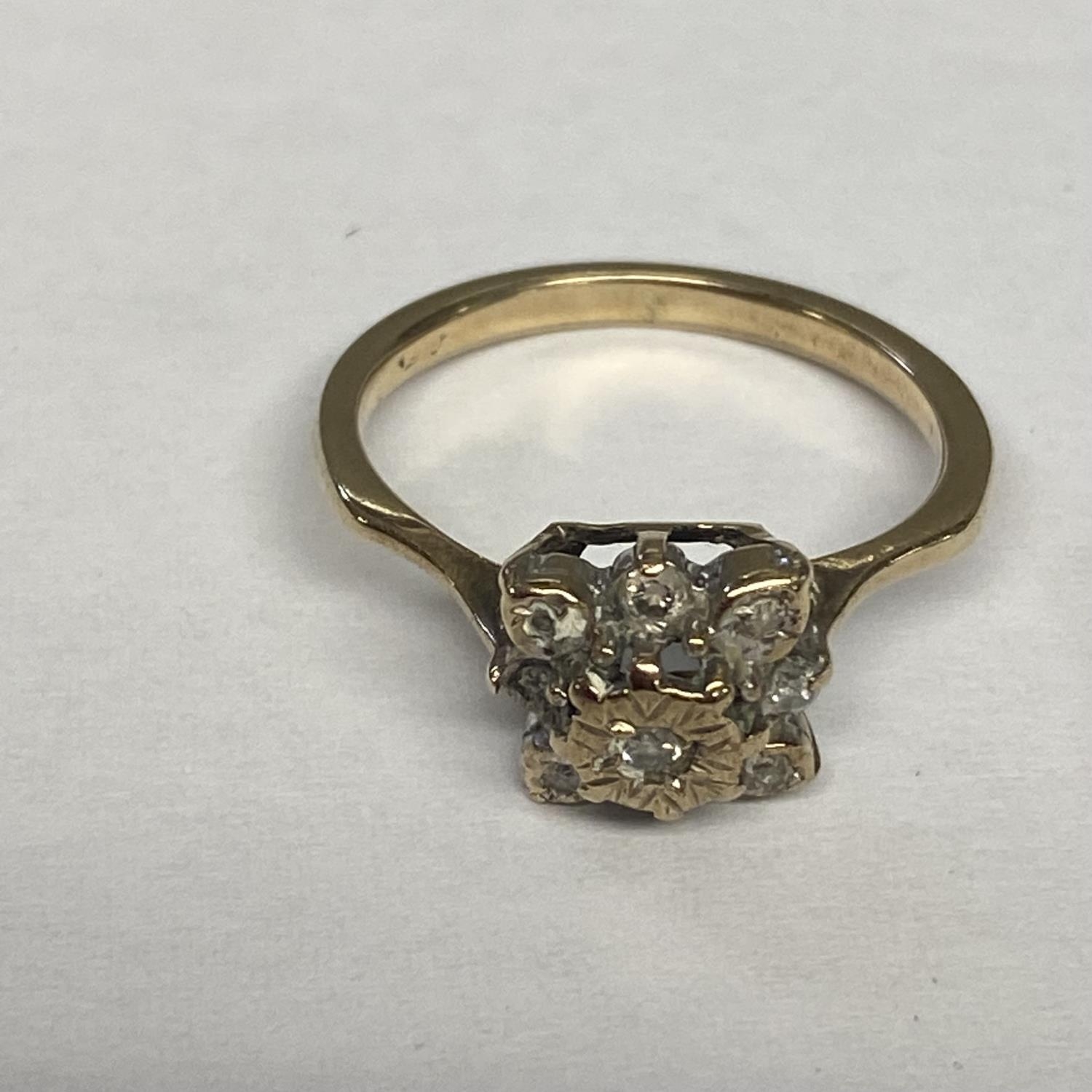 An unmarked (rubbed) yellow and white metal diamond set flower ring, size L - Image 2 of 6