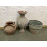A quantity of various terracotta pots, urns, and garden planters and a pair of small cast metal