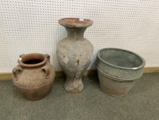 A quantity of various terracotta pots, urns, and garden planters and a pair of small cast metal