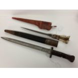 A WW1 British infantry bayonet and scabbard Broad Arrow, War Department Stamp (43cm) together with