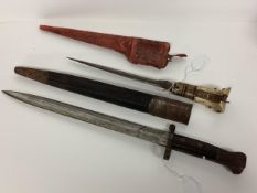 A WW1 British infantry bayonet and scabbard Broad Arrow, War Department Stamp (43cm) together with