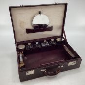 Vintage Burgundy leather travel case with fitted interior and key