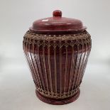 A large Chinese C19th style lacquered lidded storage har with ratan cover, 56cmH