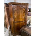 Mahogany veneered corner wardrobe, with single brass rail, 180cm H x 105cm some losses to veneer