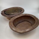 A pair of C19th style Chinese brass bound elm Shallow baths of basins, one with lift out copper