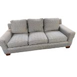A large three seater sofa, retailed by Ralph Lauren. Upholstered in a black and white Prince of