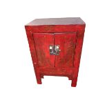 A C19th Style Chinese red lacquered wedding cabinet, of two doors decorated with Pagoda scenes;