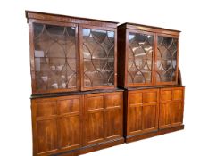 A pair of Georgian mahogany two part bookcases with moulded cornice, two glazed doors over two