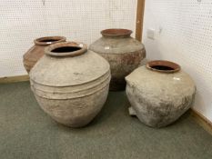 Four similar terracotta bulbous pots, tallest approx. 55cm H, all with some wear and rustic, see