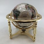A table top gem set globe in gilt metal mount with compass to base, 27cmH