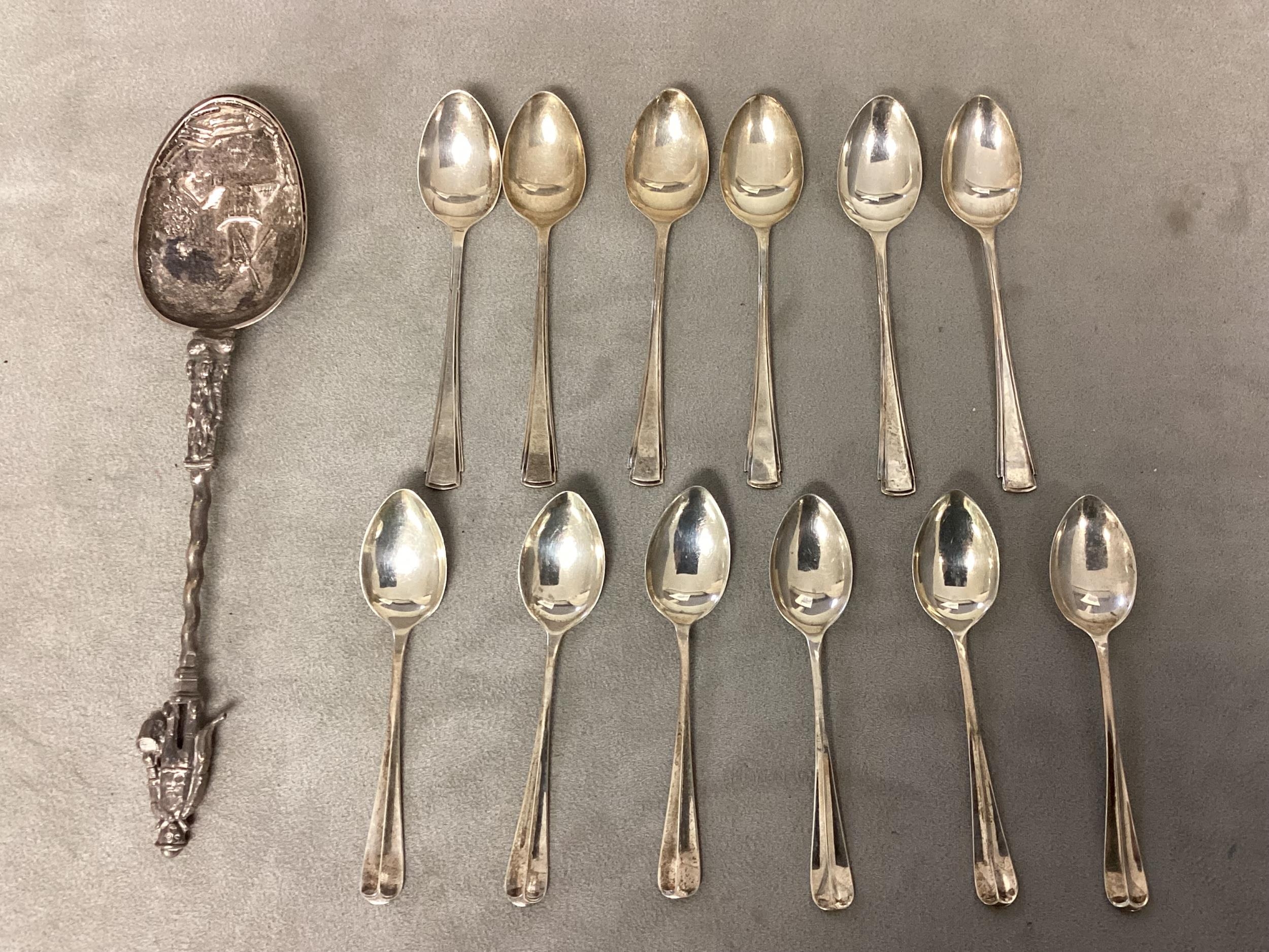 A Dutch silver apostle style spoon together with two sets of 6 Sterling silver coffee spoons, 175g