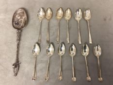 A Dutch silver apostle style spoon together with two sets of 6 Sterling silver coffee spoons, 175g