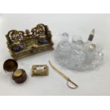 Brass desk tidy/inkwell with two ceramic inkwells and lidded recess for stamps, together with