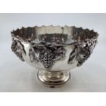Large silver plated punch bowl with cast grape and vine decoration on circular reeded foot by Walker