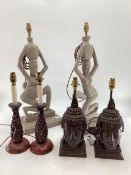 Three pairs of table lamps of South East Asian style, to include a pair of cast metal Buddha