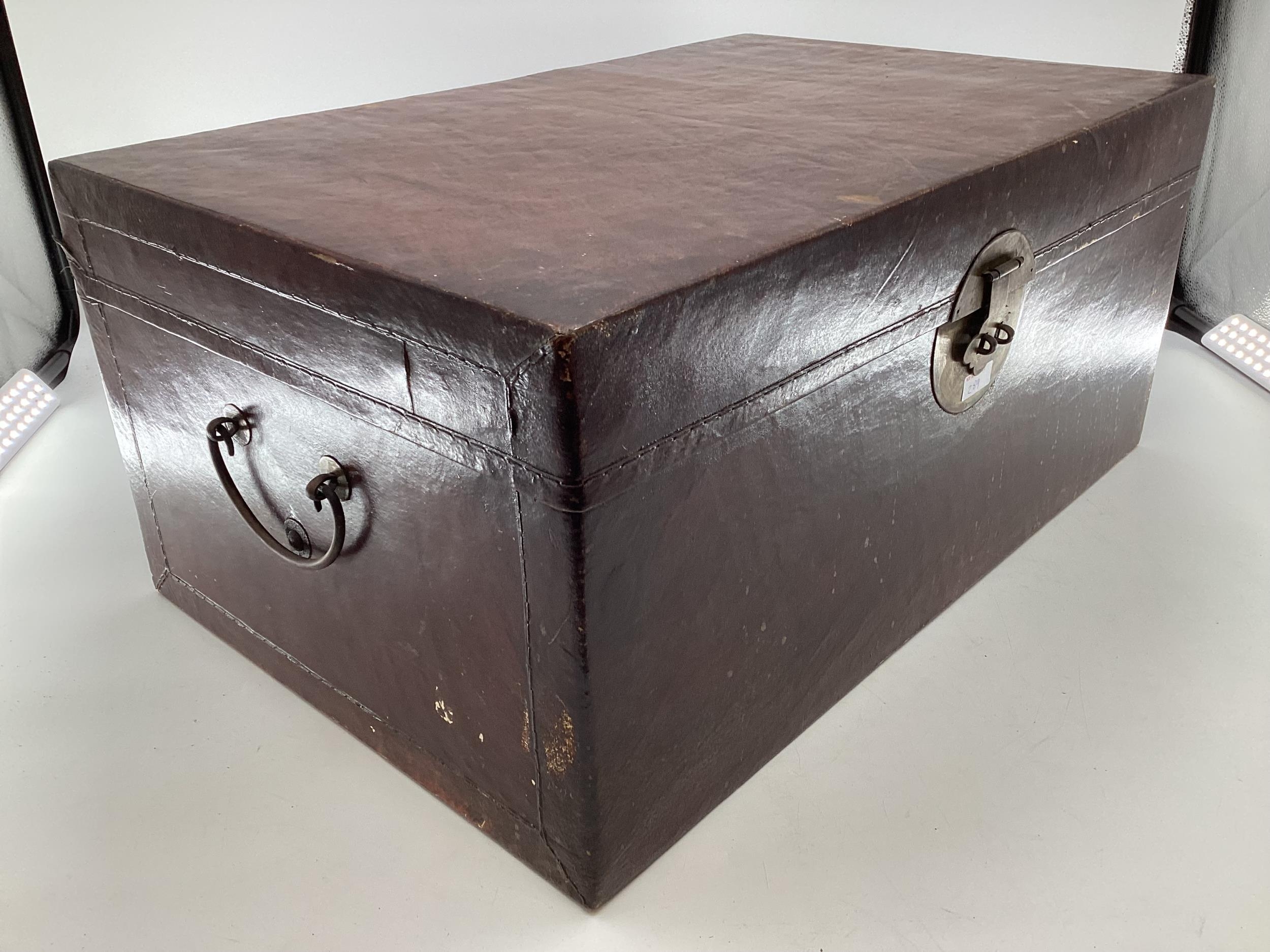 A near pair of Chinese C19th style lacquer trunks with fabric lined interiors and brass carry - Image 2 of 21