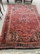 A South Persian Shiraz style red ground rug, 230 x 168cm, light wear/fading commensurate with age
