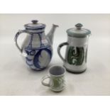 Alan Caiger-Smith two lidded jugs together with a small tea cup monograms to base, largest is 25cm ;