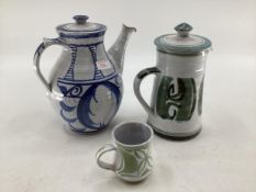 Alan Caiger-Smith two lidded jugs together with a small tea cup monograms to base, largest is 25cm ;
