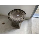 A small weathered garden staddle stone, with inverted shape top/bird bath, 44cm H