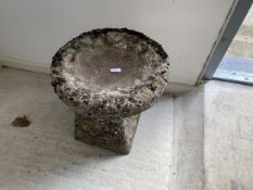 A small weathered garden staddle stone, with inverted shape top/bird bath, 44cm H