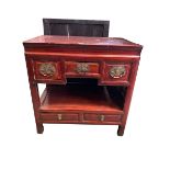 A C19th style Chinese hardwood cabinet, three short drawers over recess, belwo two drawers on square