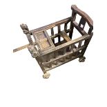 A late C19th/early C20th Style Chinese hardwood baby minder cart, yoke back with stylised lion