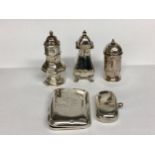 Three Sterling silver pepperettes, together with a silver sovereign case and silver cigarette