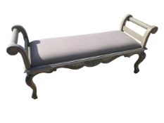 A modern upholstered grey painted window seat bench with serpentine frieze and carved cabriole legs,