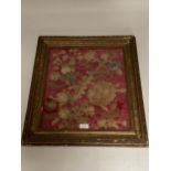 A glazed and framed C18th style silk panel with gilt thread decoration depicting leaves, flowers and
