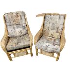 Two wicker style arm chairs with cushions and a cream leather sofa and chairs suite