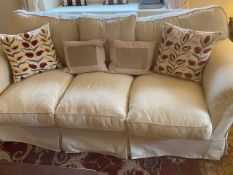 Pair of cream upholstered three seater sofas, 225cmL, with some wear, sold as seen (2 sofas)