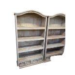 A pair of vintage chalk painted and distressed arch topped open bookcases, four fitted shelves