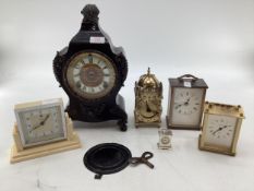 French cast metal mantle clock with white enamel chapter ring in the Rococo style by Ansonia Clock